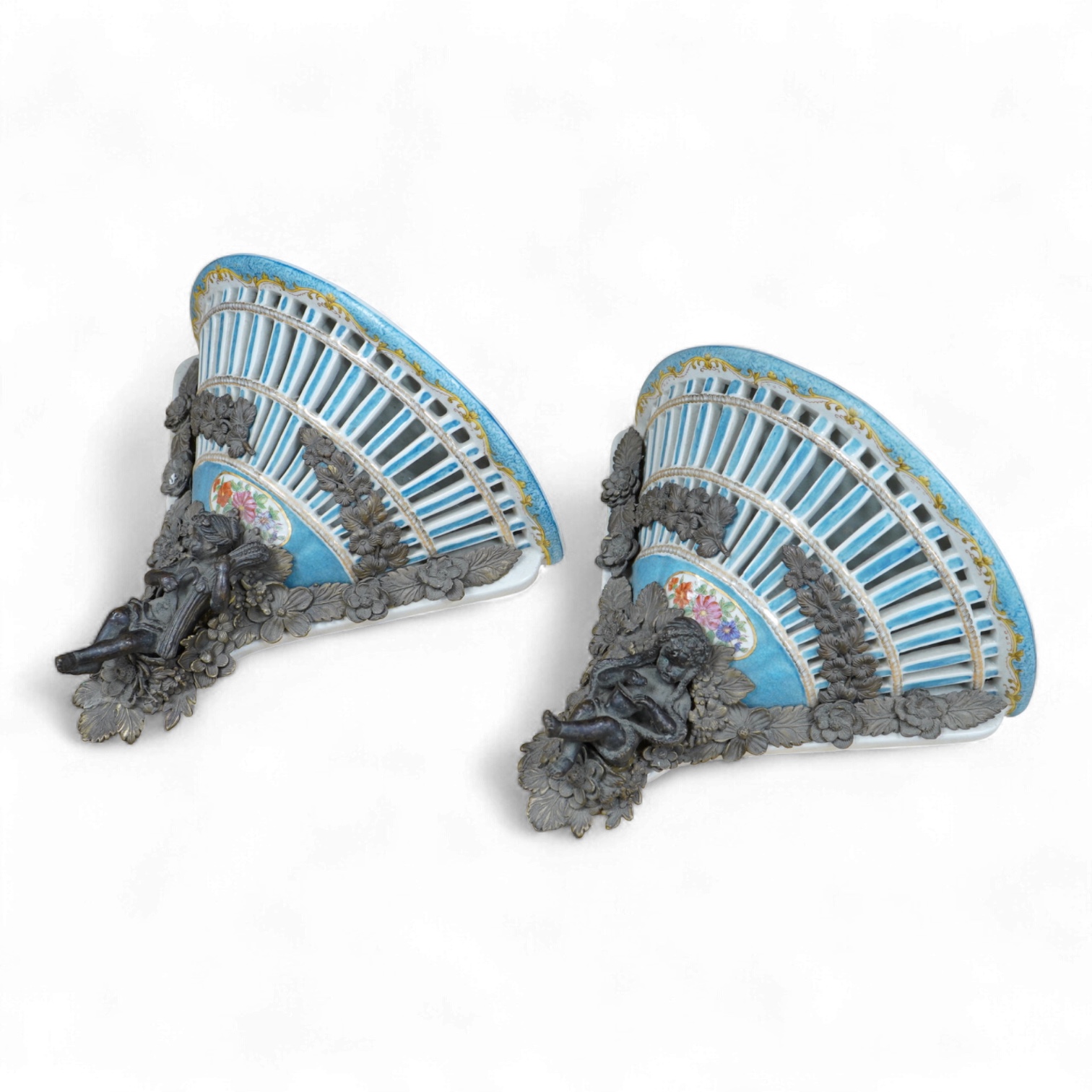 A pair of Sevres style pierced ceramic brackets with bronze mounts, 26 x 31cm